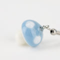 Handmade borosilicate blue mushroom earrings on white background
