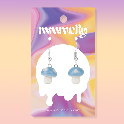 Cute glass earrings shaped like mushrooms that glow