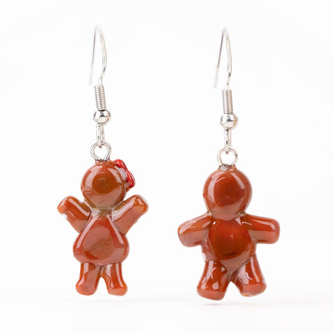 Cute holiday glass earrings shaped like gingerbread cookies